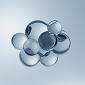 A cluster of glossy, reflective silver glass spheres arranged in a circular pattern against a light blue gradient background.